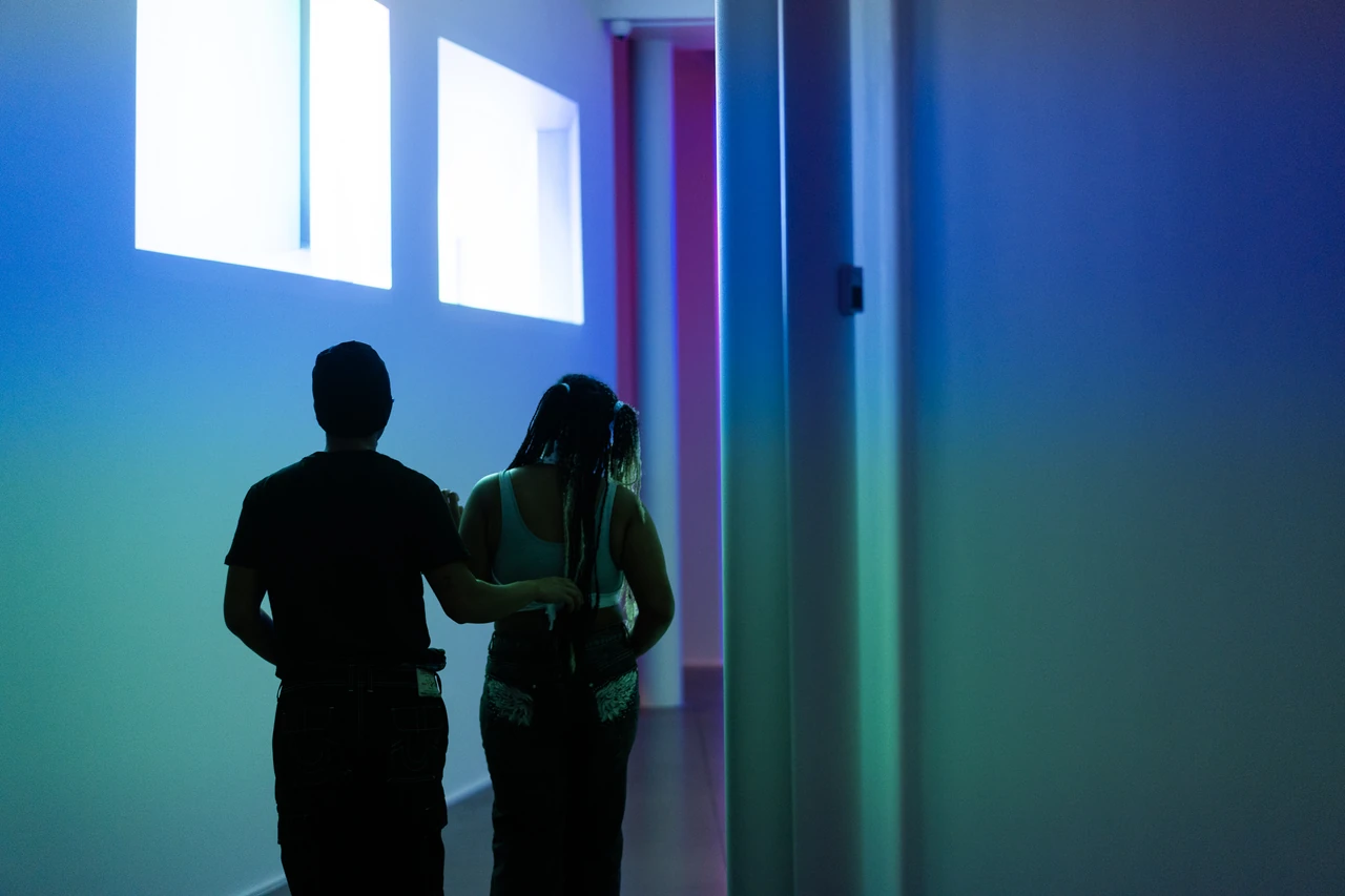 Visitors experience projected light in Frequency and Perspective at Oklahoma Contemporary.